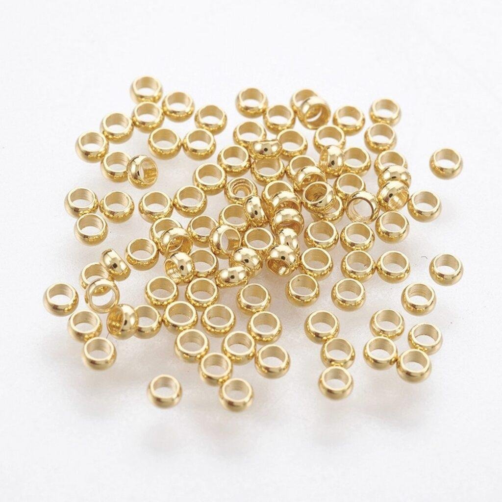 RVS knijpkralen gold plated 2 mm — 50 stuks