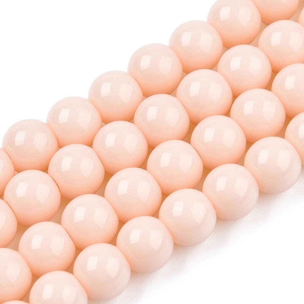 Ronde glaskralen perzikroze 6–6,5 mm — circa 62 stuks